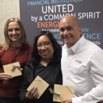 DuPage Credit Union leadership—Amy Brandt and George Caraballo—pose with Rhonda Eubanks, Director of the Parents as Teachers Program, to celebrate the Credit Union's donation.