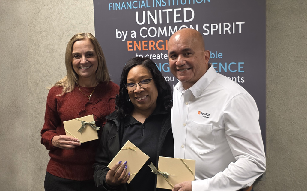 DuPage Credit Union leadership—Amy Brandt and George Caraballo—pose with Rhonda Eubanks, Director of the Parents as Teachers Program, to celebrate the Credit Union's donation.