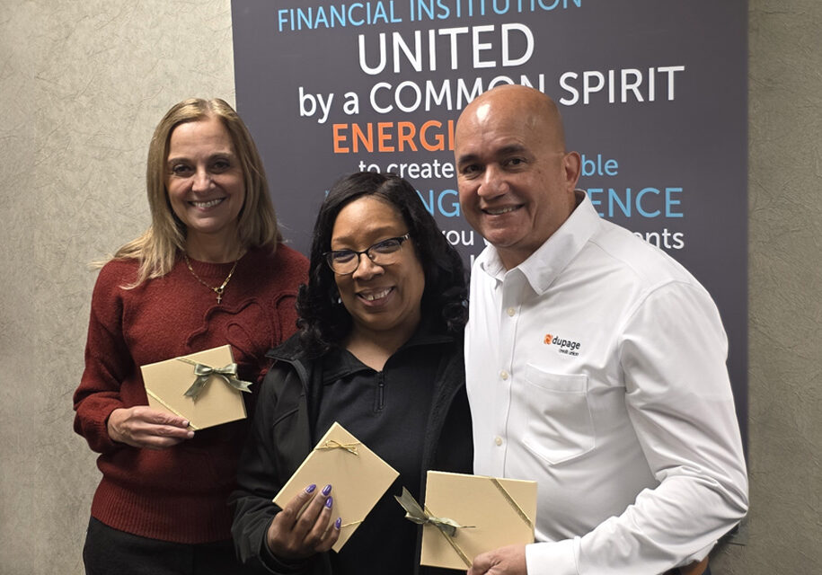 DuPage Credit Union leadership—Amy Brandt and George Caraballo—pose with Rhonda Eubanks, Director of the Parents as Teachers Program, to celebrate the Credit Union's donation.