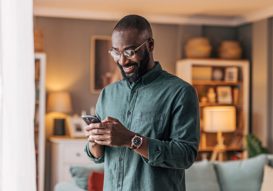Man using his phone inside
