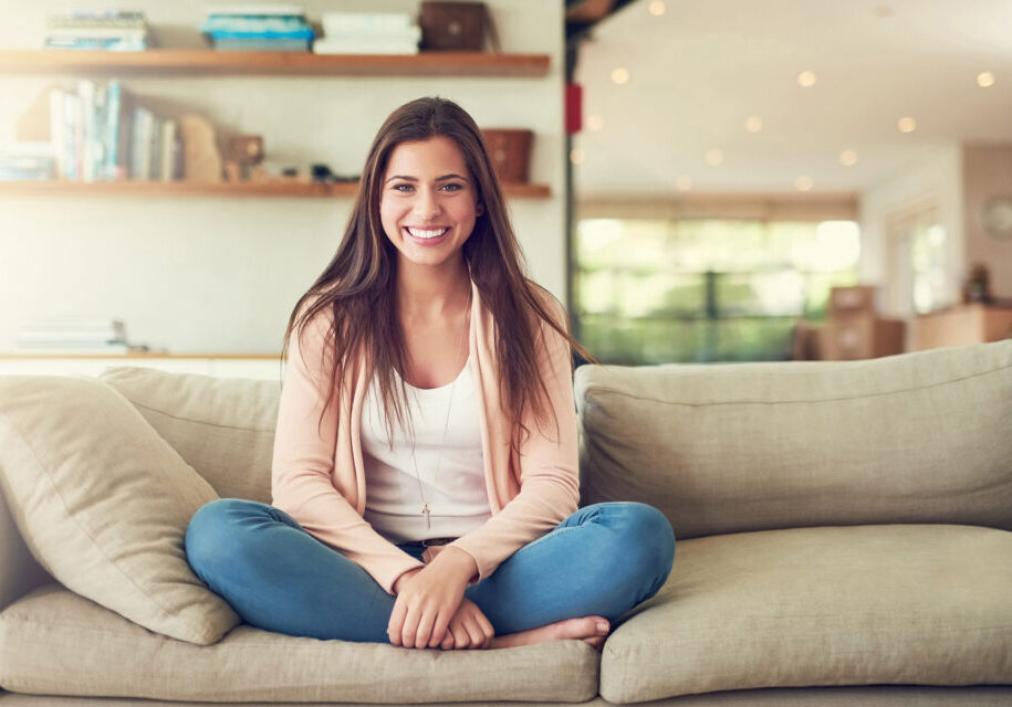 Woman sitting on couch