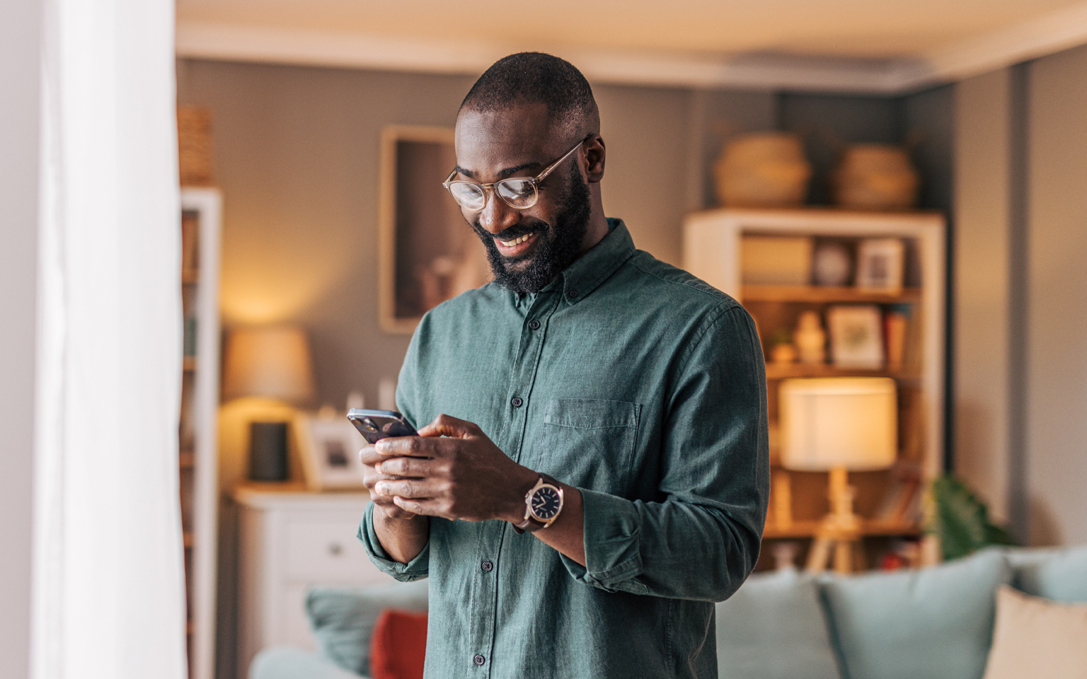 Man using his phone inside